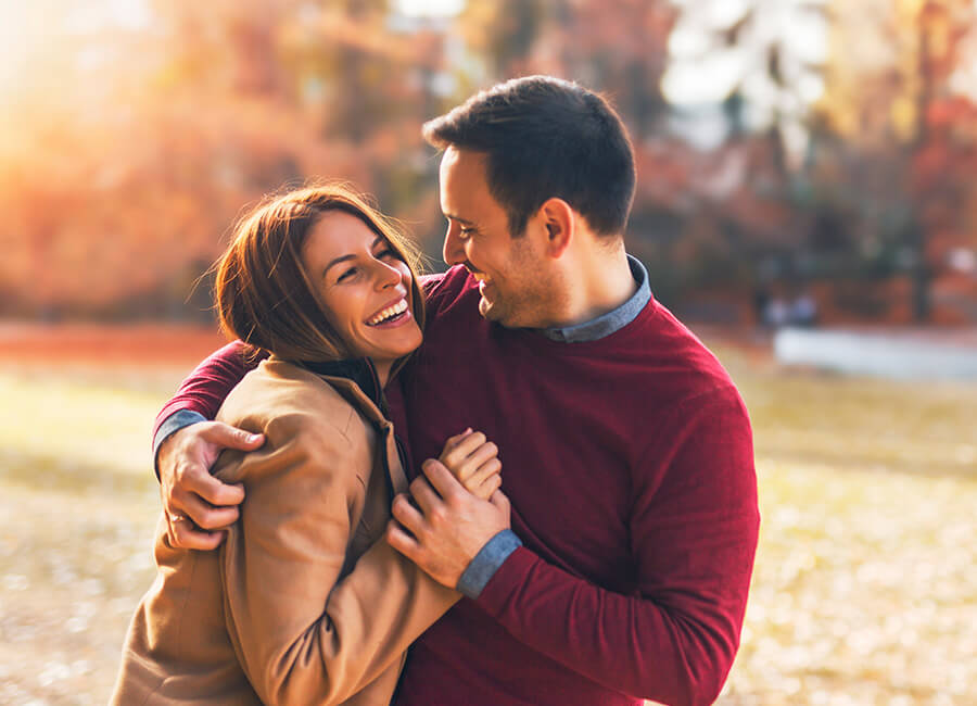 couple hugging outdoors in autumn